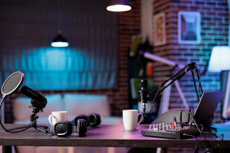 Podcast host smiling while recording